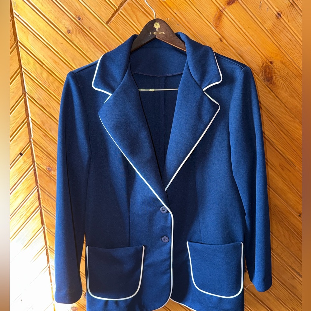vintage blue woman’s blazer with white pipping